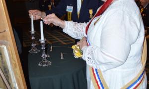 CinC Hritsko and NP Freshley lighting memorial Candles